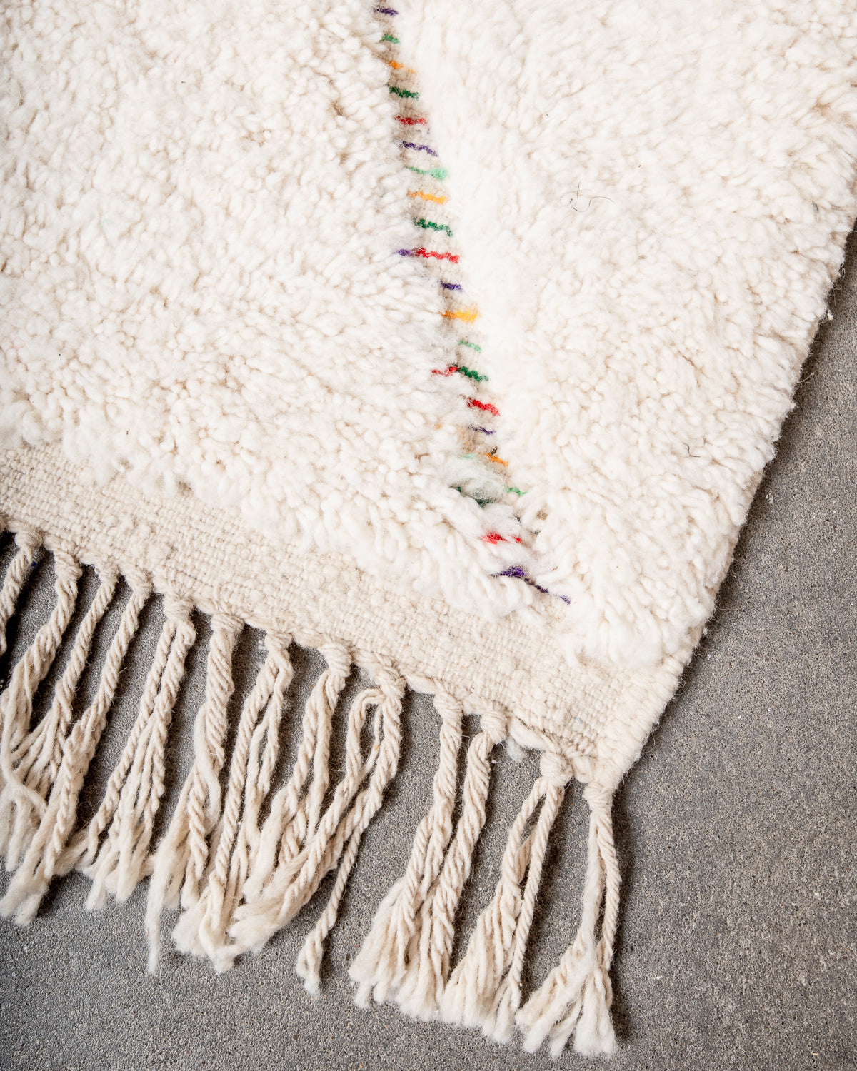 Modern, designer, handcrafted Berber rug from Morocco. Beniourain carpet with beautiful colours and patterns and fluffy wool texture.